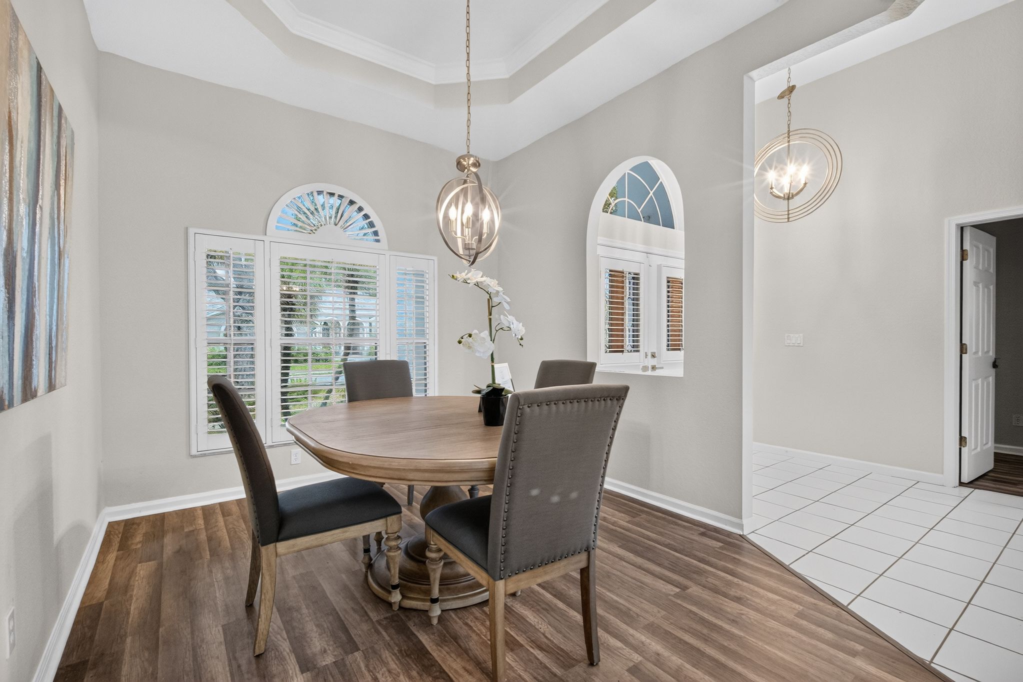 Formal dining room with arched windows